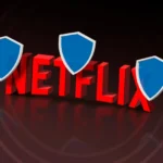 Biểu tượng Netflix 3D với các lá chắn bảo vệ, tượng trưng cho việc vượt qua chặn địa lý khi xem nội dung trực tuyến bằng VPN.