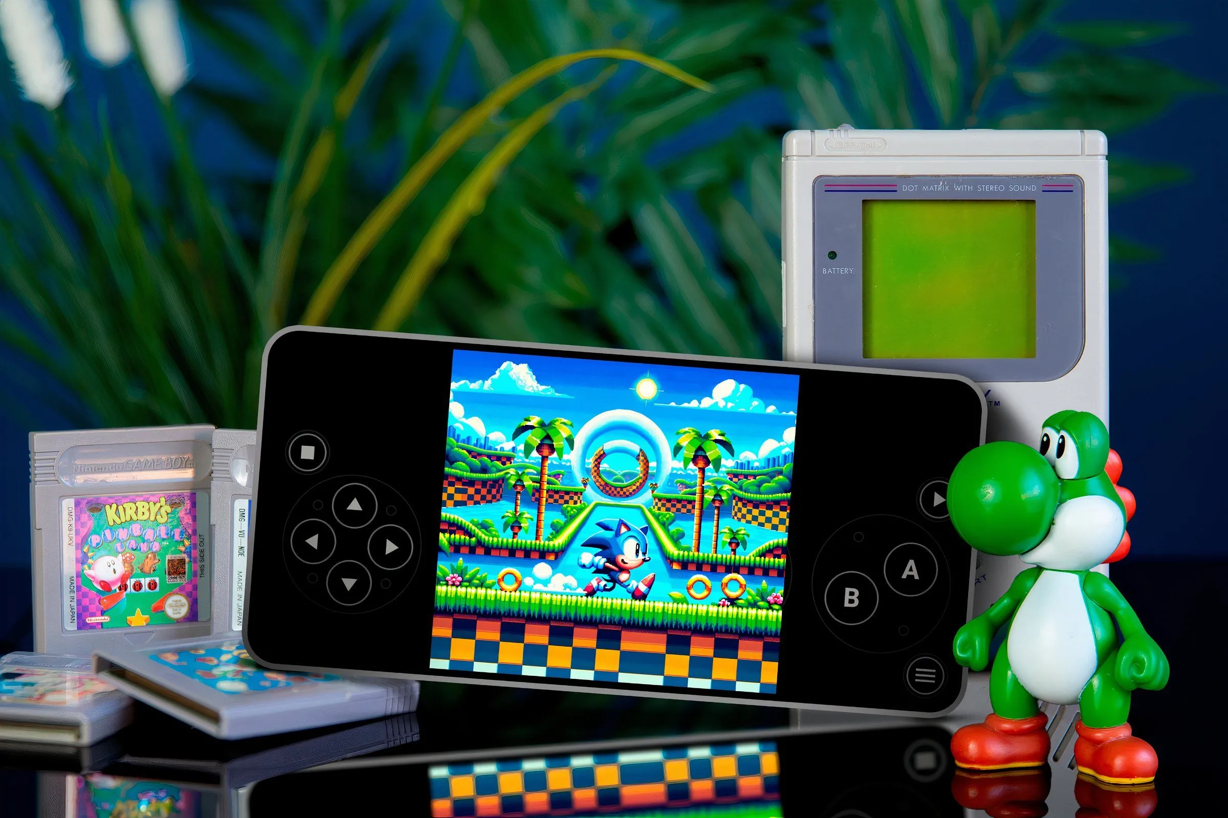 Điện thoại đang chạy trò chơi Sonic trên giả lập, xung quanh là các băng game và một mô hình nhân vật Yoshi