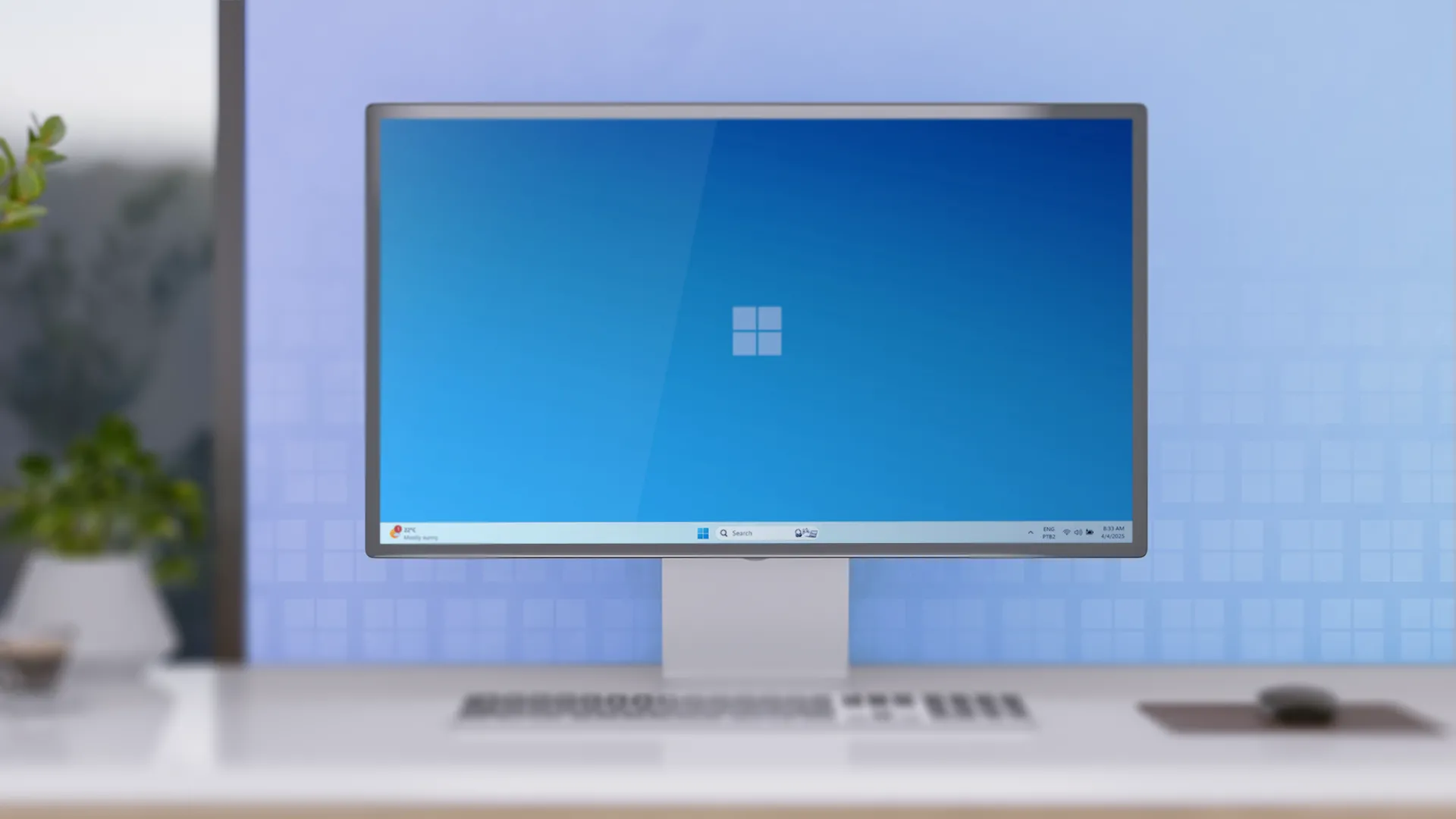 Góc làm việc tối giản với máy tính để bàn chạy Windows 11, màn hình và bàn phím.