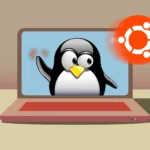 Laptop với hình ảnh linh vật Tux vẫy chào logo Ubuntu trên màn hình.