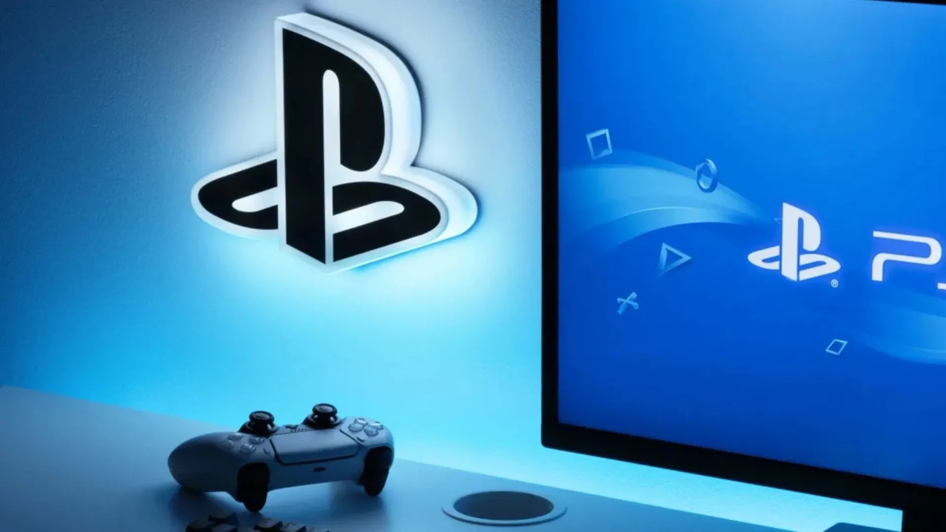 Logo PlayStation và tay cầm DualSense cùng màn hình hiển thị logo PS5, biểu tượng của nền tảng Sony