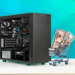 Thùng máy tính PC gaming và xe đẩy siêu thị chứa tiền đô, tượng trưng cho chi phí đầu tư phần cứng.