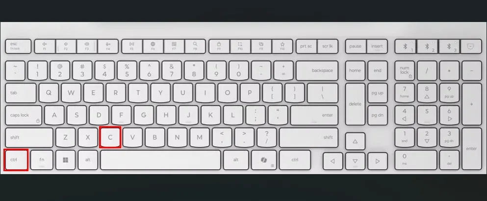 Bàn phím trắng với ô đỏ làm nổi bật phím Ctrl và C, minh họa phím tắt để sao chép tập tin hoặc ngắt lệnh trong Ubuntu