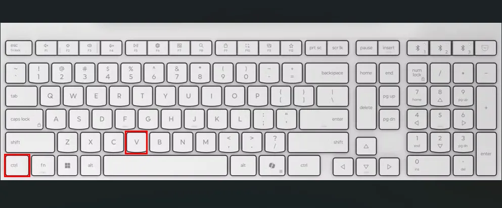 Bàn phím trắng với ô đỏ làm nổi bật phím Ctrl và V, minh họa phím tắt để dán nội dung đã sao chép trong Ubuntu