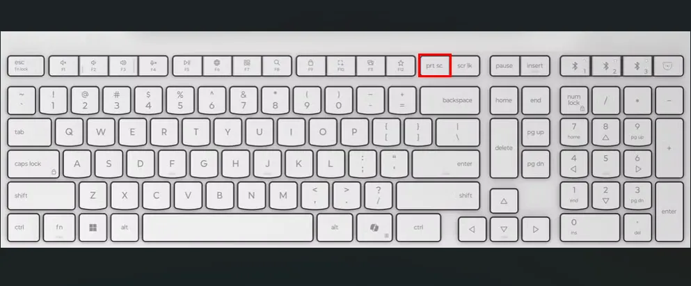 Bàn phím trắng với ô đỏ làm nổi bật phím PrtSc (Print Screen), minh họa phím tắt chụp màn hình toàn bộ trên Ubuntu