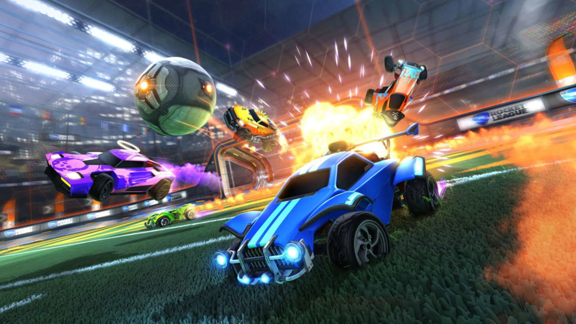 Một cảnh hỗn loạn và gay cấn trong Rocket League với những chiếc xe và quả bóng đang bay trên không trung.