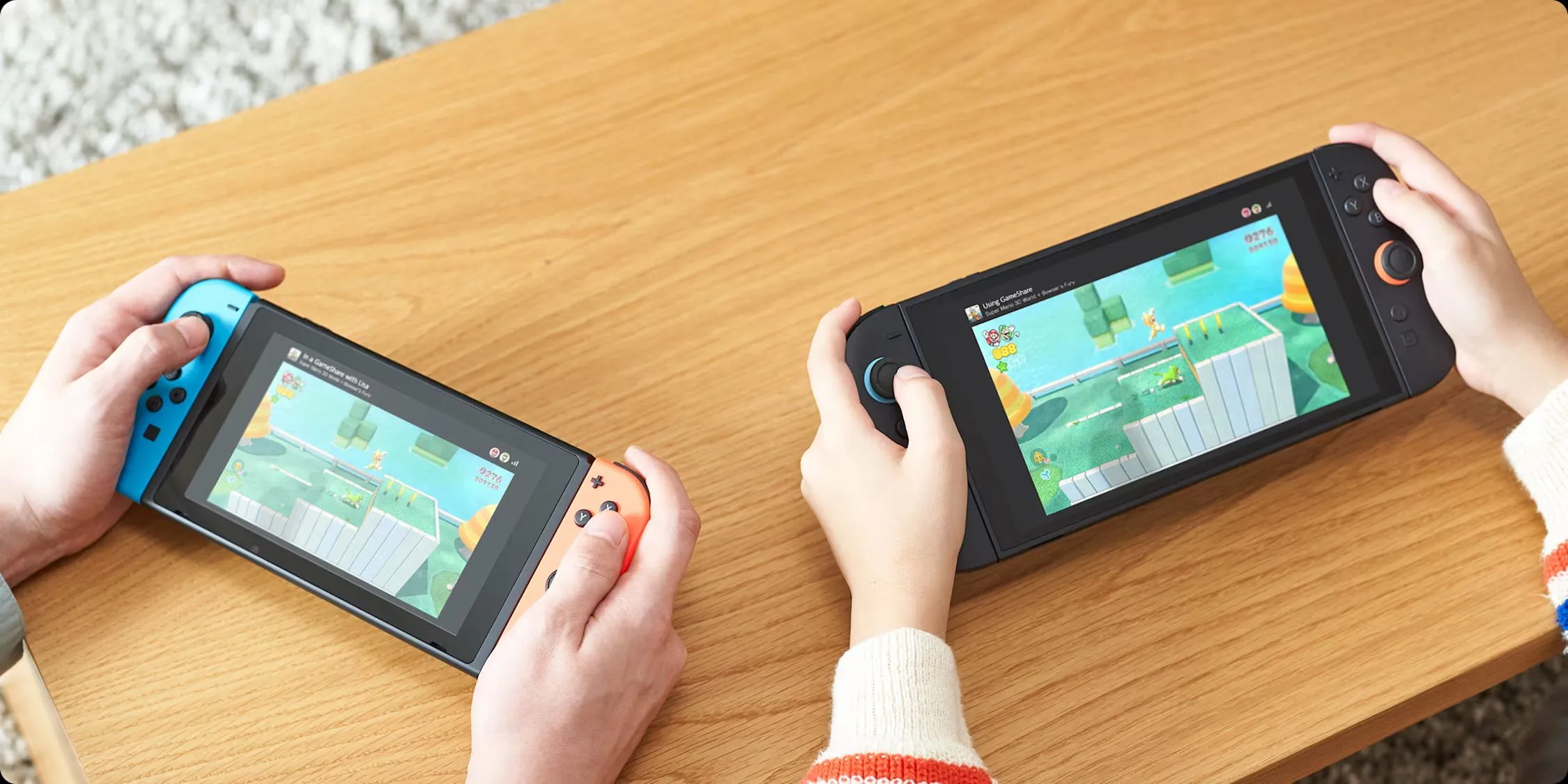 Một máy Nintendo Switch 2 đang sử dụng tính năng GameShare để chia sẻ trò chơi với máy Nintendo Switch thế hệ đầu tiên.