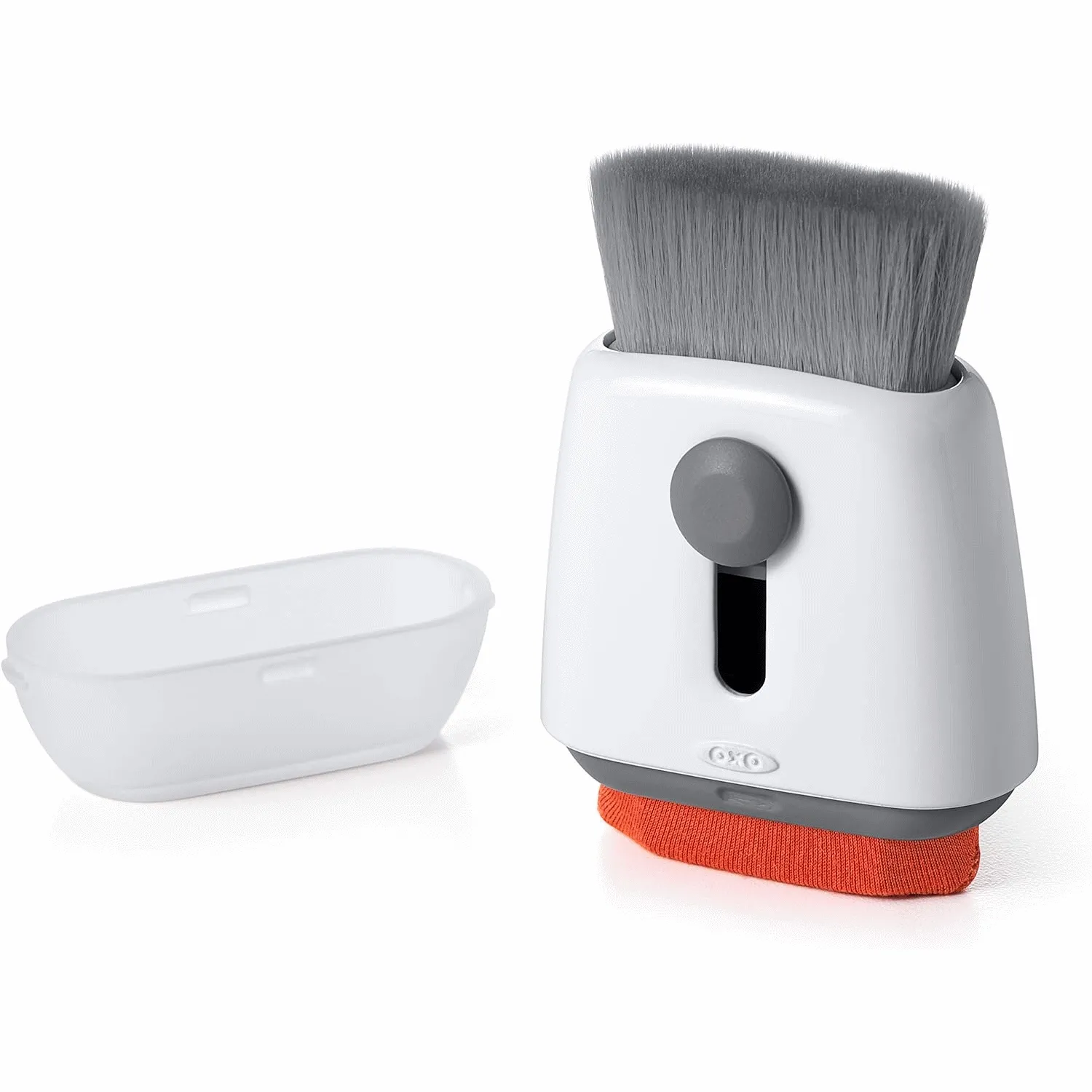 Cọ vệ sinh OXO Good Grips Sweep &amp; Swipe giúp loại bỏ bụi bẩn và lông thú cưng khỏi thiết bị điện tử.